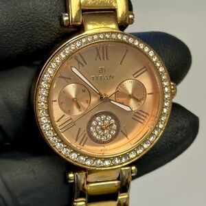 Titan 95023WAA Day-Date Gold Stainless Steel 32mm Ladies’ Dress Watch